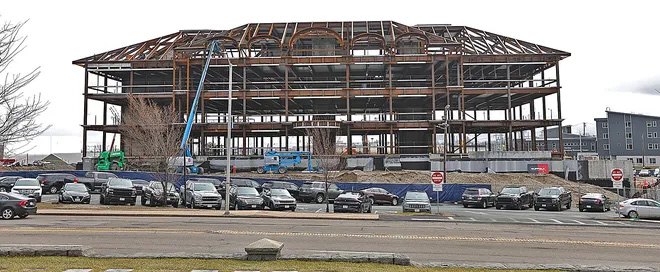 A public safety facility under construction, steel frame erected and site work in progress